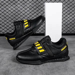 Professional black and yellow weightlifting shoes for deadlift and powerlifting training.