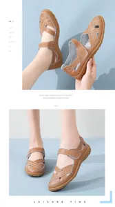 Close-up view of brown leather hollow-out flat sandals for women featuring soft rubber soles