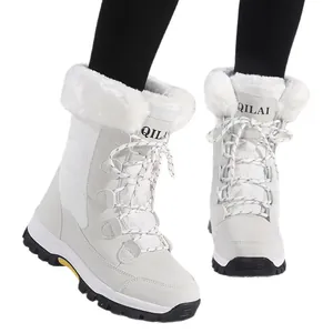 White women's outdoor snow boots with faux fur trim and lace-up design