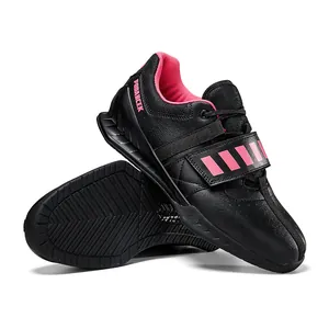 Professional black and pink weightlifting shoes for squat and powerlifting training.