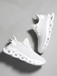 Detailed side view of stylish white breathable mesh fashion running sneakers on grey