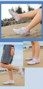 Child wearing pink camouflage quick-dry water shoes on a sunny sandy beach outdoors