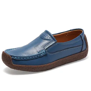 Comfortable blue leather loafers for women with textured finish and flat gum sole.