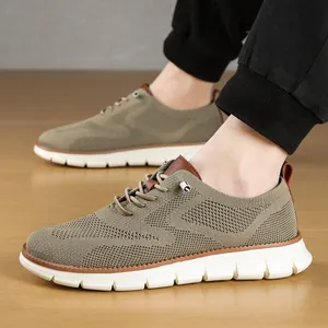 Side view of men's breathable khaki mesh loafers with lightweight white soles