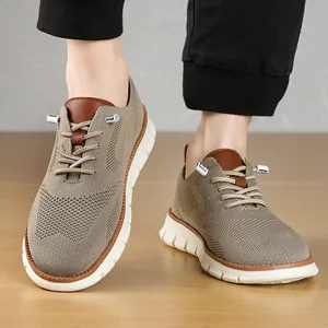 Close-up of breathable khaki mesh men's loafers with lightweight white rubber soles