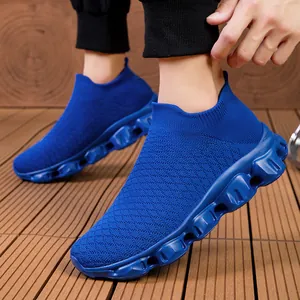 Royal blue breathable fly-knit sneakers featuring chunky cushioned popcorn soles for running