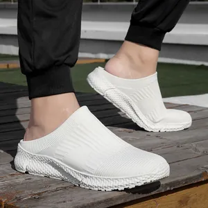 Detail view of white flyknit slip-on sneakers for men featuring a breathable mesh design