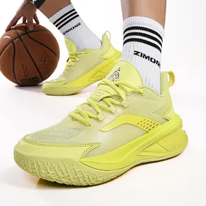 Vibrant bright yellow mid-top basketball shoes designed for professional youth training