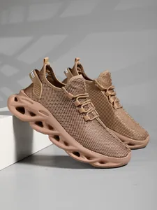 Close-up of brown mesh sneakers with unique wavy hollowed-out sole design