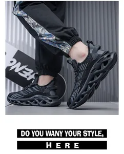 Close-up of black men's running shoes featuring shock-absorbing wavy soles.