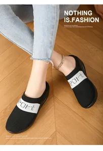 Comfortable women's fly-knit platform mules with sport knit detail on wooden floor