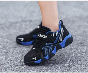 Close-up shot of boys' stylish breathable mesh running shoes being worn for outdoor sports