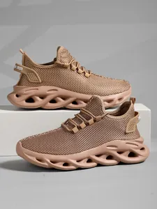 Detail view of breathable mesh running shoes in tan with hollow shock-absorbing sole.