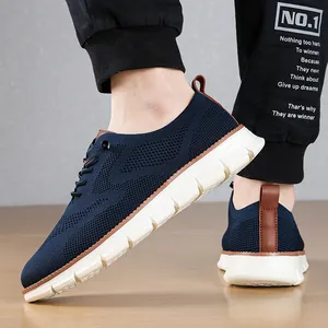 Close-up view of breathable navy blue mesh men's loafers with thick white soles