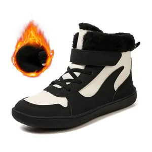 Botas de nieve de invierno para niños con forro polar cálido en blanco y negro.