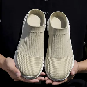 Detailed view of beige breathable mesh slip-on sneakers for men with soft soles