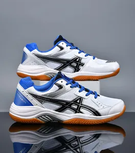 Detailed side view of professional blue and white badminton shoes with gum soles.