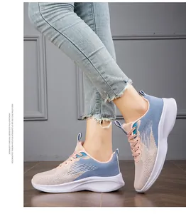 Close-up of lightweight and breathable pink and blue knitted mesh women sneakers