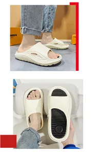 Detail showing the textured black insole and circular logo of the white sport slides