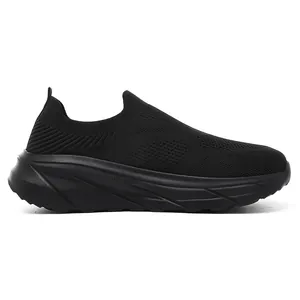 Side profile of breathable black fly-knit slip-on sneaker for men with thick sole.
