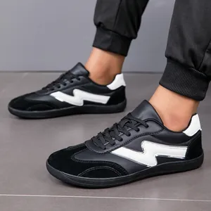 Detailed close-up view of stylish black men's casual athletic shoes with white bolt design