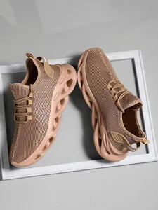 Close-up of breathable brown mesh men's sports shoes with shock-absorbing hollowed-out sole.