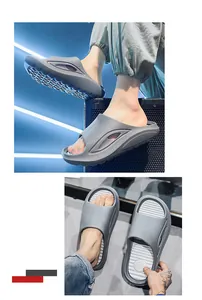 Close-up of grey sports slides showing non-slip sole and breathable side design