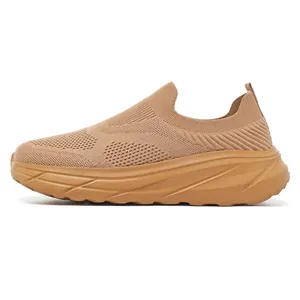 Close-up side view of a breathable tan fly-knit slip-on walking sneaker for men