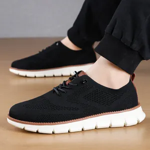 Close-up of black breathable mesh sneakers for men showing lightweight sole and texture