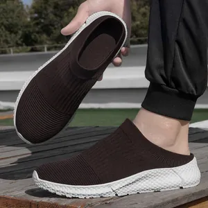 Detailed view of men's brown fly-knit slip-on casual shoes with textured white sole