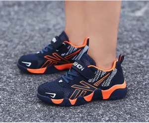Detailed side view of breathable navy and orange children's sports running shoes.