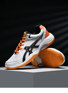 Close-up of professional badminton shoes showing durable rubber sole and mesh texture