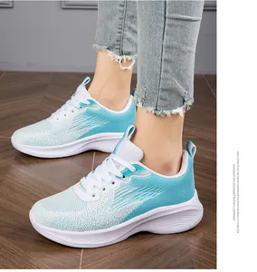 Detailed on-foot view of lightweight light blue breathable fly-knit women's running sneakers