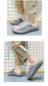 Close-up of grey breathable sports slides with non-slip thick sole for beach and home