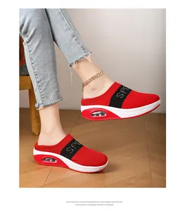 Detailed view of red knit mule sneakers with comfortable platform air cushion sole