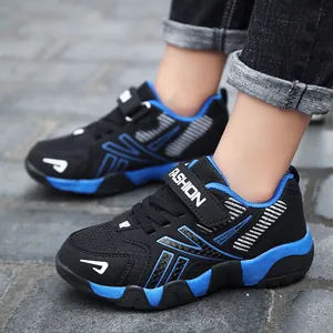 Detailed view of breathable mesh and leather children's sports shoes with blue accents