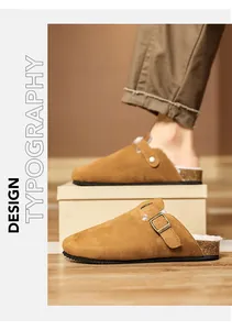 Detail of brown suede clogs with buckle strap and cozy fleece lining