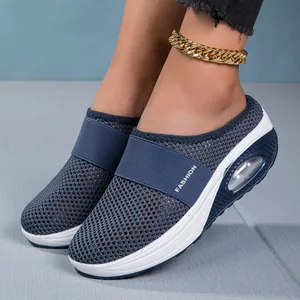 Detailed view of breathable blue mesh mules with a supportive air cushion sole