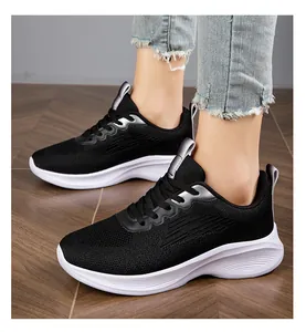 Close-up of lightweight black knit running shoes for women with white soles