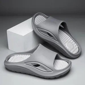 Ergonomic grey sports slides with breathable side cutouts and non-slip ribbed footbed
