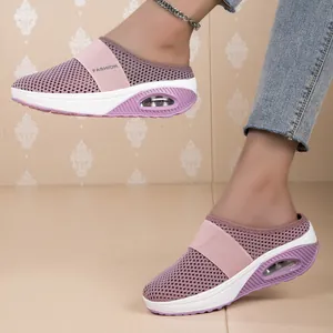 Detail view of purple breathable mesh mules with comfortable air cushion sole