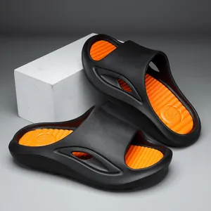 Fashionable black and orange sports slides with non-slip ribbed footbed