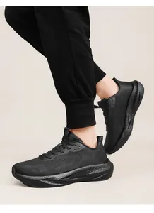 Close-up of black breathable knit running shoes featuring cushioned thick soles