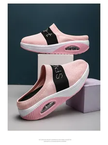 Close-up of pink knit platform mules featuring air cushion sole and breathable mesh