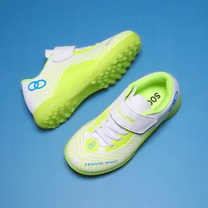 Children's turf soccer shoes in neon yellow and white with anti-slip rubber sole