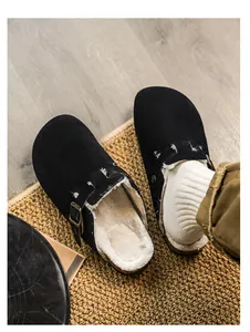 Cozy black suede clogs featuring warm faux fur lining for premium autumn and winter comfort.