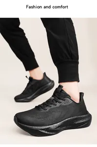 Detailed view of breathable black knit running shoes with carbon plate cushioning