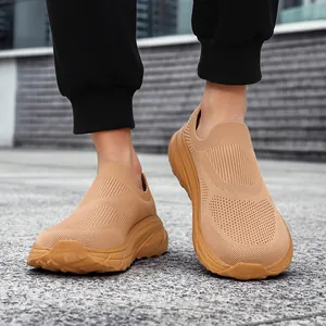 Close-up of men's breathable khaki fly-woven slip-on sneakers with thick soles