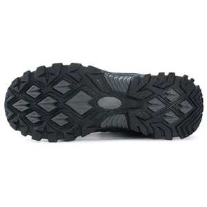Detailed view of rugged black rubber outsole for men's outdoor work shoes with anti-slip tread