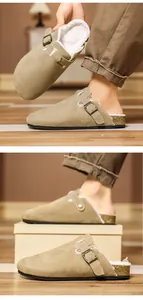 Close-up detail of beige suede clogs with warm fleece lining and adjustable buckle.